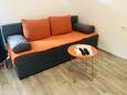 Obývací pokoj Kozarica, Obývací pokoj v ubytování typu apartment.