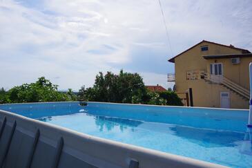 Barbat, Rab, Property 4988 - Apartments with pebble beach.