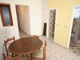 Jezera, Dining room in the apartment, air condition available, (pet friendly) and WiFi.