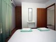 Tisno, Ložnice v ubytování typu room, s klimatizací a WiFi.