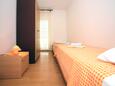 Tisno, Bedroom 2 in the apartment, (pet friendly) and WiFi.