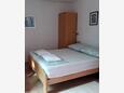 Sypialnia Maslinica, Sypialnia w zakwaterowaniu typu studio-apartment, Dostępna klimatyzacja, zwierzęta domowe są dozwolone i WiFi.