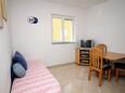 Obývací pokoj Baška, Obývací pokoj v ubytování typu apartment, s klimatizací a WiFi.