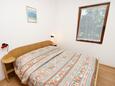 Njivice, Bedroom in the apartment, air condition available and WiFi.