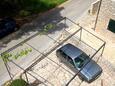 Parking lot Vrboska, Hvar, Parking lot 552 - Apartments with pebble beach.