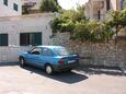 Parking lot Postira, Brač, Parking lot 5609 - Apartments near sea with pebble beach.