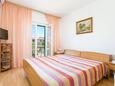 Ložnice Supetar, Ložnice v ubytování typu room, s klimatizací a WiFi.