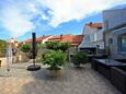Supetar, Brač, Courtyard 5665 - Apartments with pebble beach.
