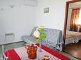 Vinjerac, Sala de estar in the apartment, air condition available y WiFi.