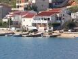 Metajna, Pag, Propiedad 6395 - Apartamentos near sea with pebble beach.