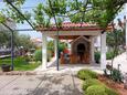 Vodice, Vodice, Courtyard 6452 - Apartments with pebble beach.