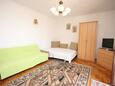 Obývací pokoj Kustići, Obývací pokoj v ubytování typu apartment, s klimatizací a WiFi.