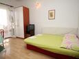 Obývacia izba Makarska, Obývacia izba v ubytovacej jednotke apartment, klimatizácia k dispozícii a WiFi.