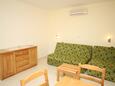 Living room Baška Voda, Living room in the apartment, air condition available and WiFi.