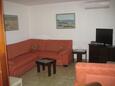 Maslinica, Living room in the apartment, air condition available, (pet friendly) and WiFi.