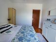 Maslinica, Dormitorio in the apartment, air condition available y WiFi.