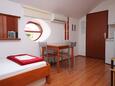 Dining room Mali Lošinj, Dining room in the studio-apartment, air condition available and WiFi.