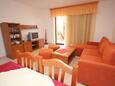 Cres, Living room in the apartment, air condition available and WiFi.