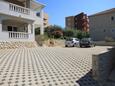 Parking lot Trogir, Trogir, Parking lot 8683 - Apartments near sea with pebble beach.
