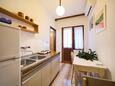 Dining room Komiža, Dining room in the apartment, air condition available and WiFi.
