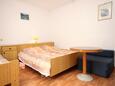 Cavtat, Bedroom in the apartment, air condition available and WiFi.