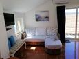 Living room Lumbarda, Living room in the studio-apartment, air condition available and WiFi.