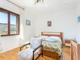 Спальня 1 Trogir, Спальня 1 в размещении типа apartment, доступный кондиционер и WiFi.