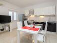 Dining room Seget Vranjica, Dining room in the apartment, air condition available, (pet friendly) and WiFi.